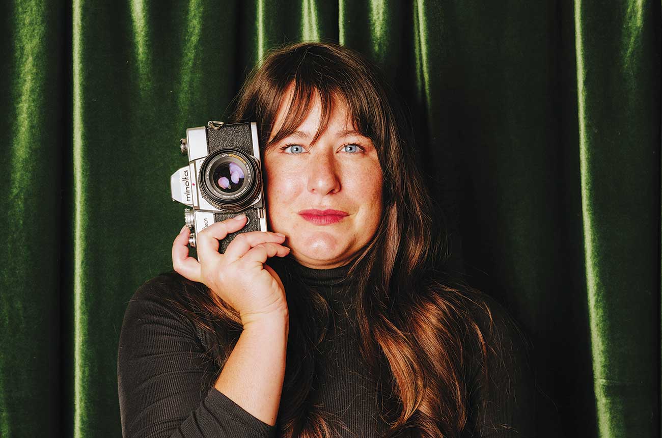 Heather Daenitz holding camera