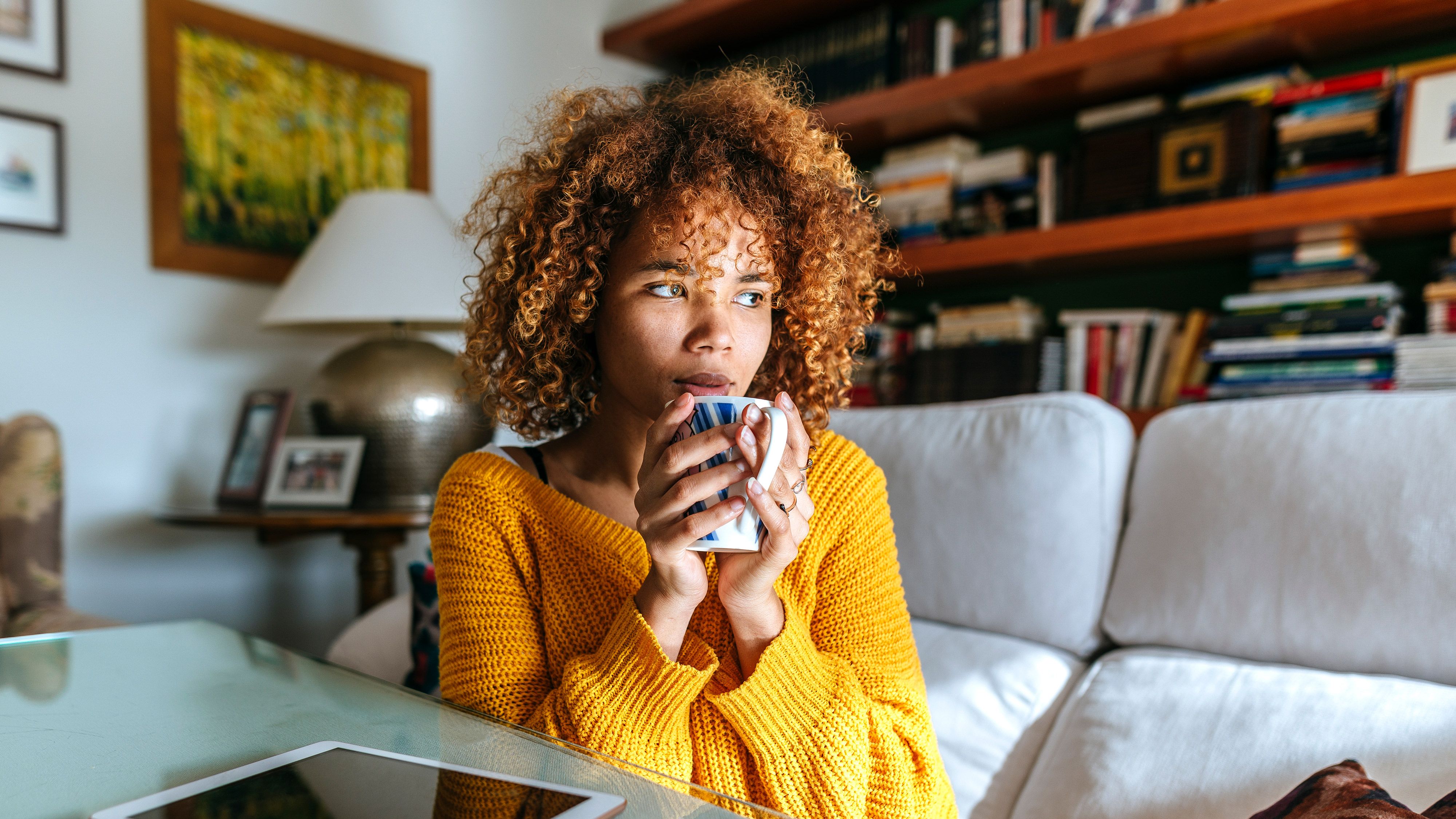 Hair, Yellow, Hairstyle, Room, Couch, Sitting, Furniture, Vacation, Afro, Table,
