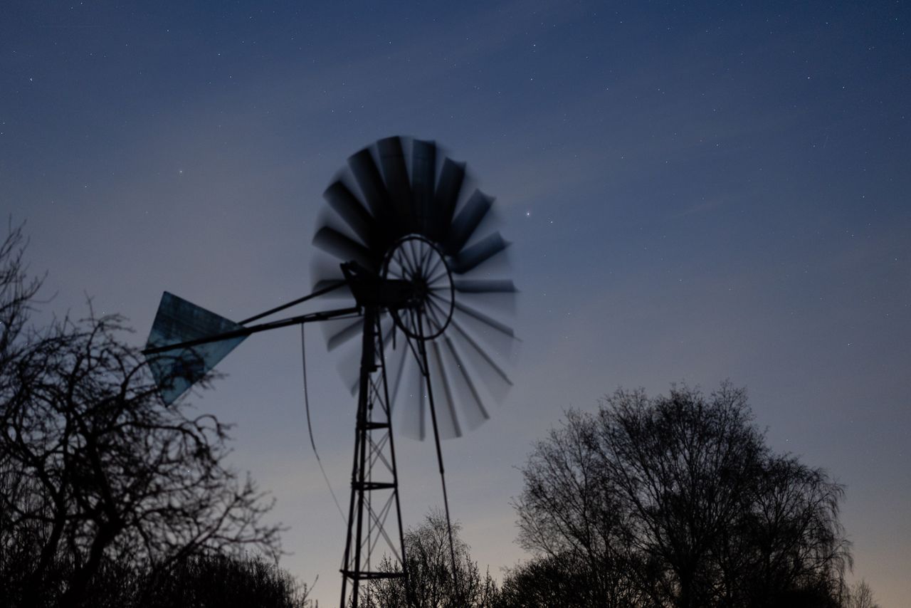 A wind pump at night shot with a Canon RF 85mm f/1.2L USM lens