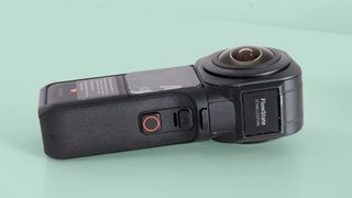 The Insta360 ONE RS 1-Inch 360 Edition camera on a green background