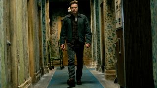Ewan McGregor walks down a rotting hallway at The Overlook Hotel in Doctor Sleep.