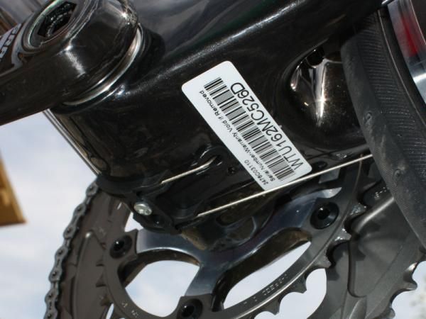 A molded plastic cable guide smoothes the bend as the cable makes its way up to the front derailleur.