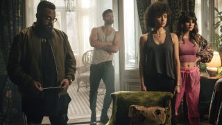 Guz Khan, Stuart Martin, Nathalie Emmanuel, and Ruby O. Fee stand lined up in the den in Army Of Thieves.