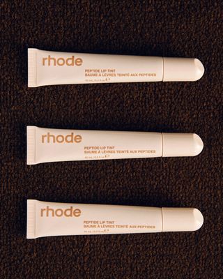 three tubes of rhode lip tint in cinnamon roll