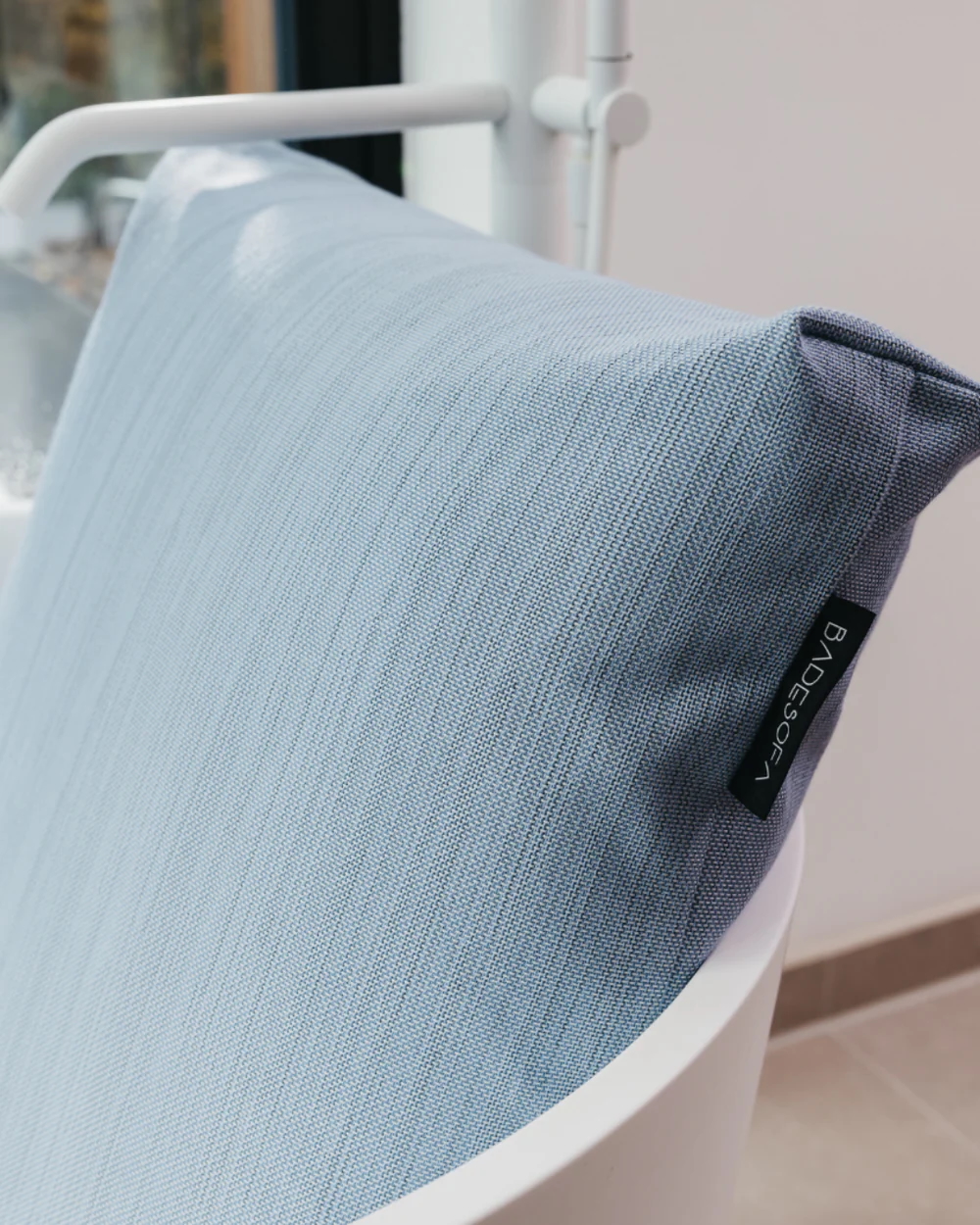 A Badesofa back pillow in a bathtub