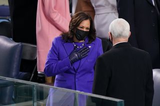 Kamala Harris wears a purple christopher john rogers coat at the inauguration