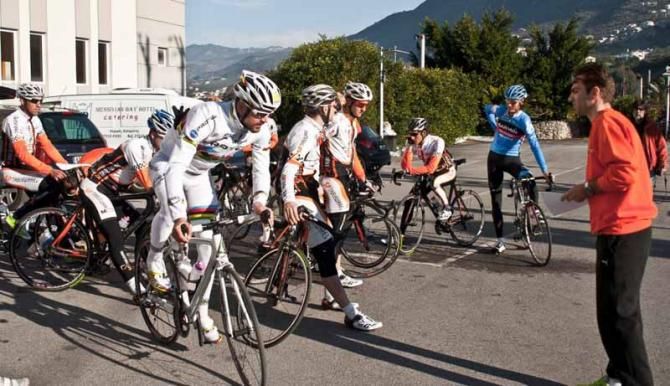 Vasilis Anastopoulos (in the orange sweater) gives final training instructions