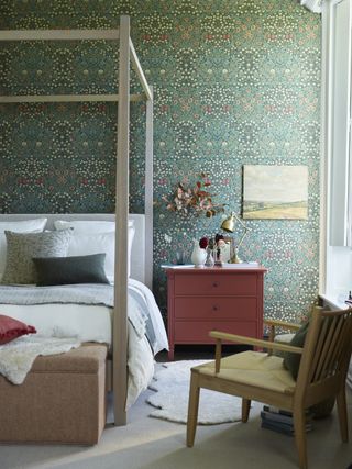 Neptune bedroom with William Morris green Blackthorn wallpaper and red chest of drawers