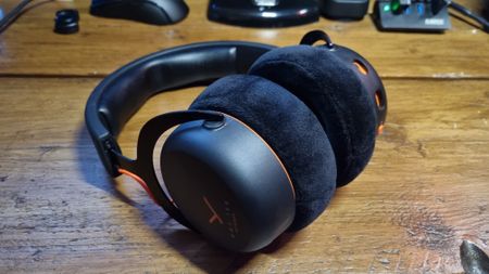 A Beyerdynamic MMX 150 Wireless gaming headset on a wooden desk
