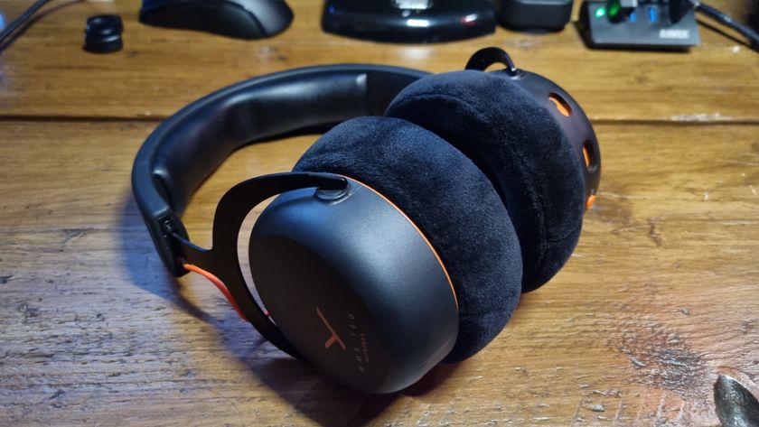 A Beyerdynamic MMX 150 Wireless gaming headset on a wooden desk