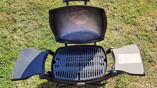 Weber Q1200 portable gas grill being tested in writer's home
