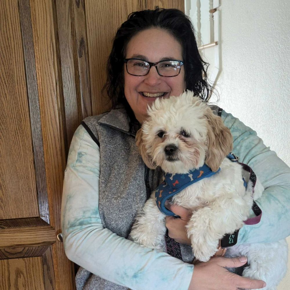 Nina holding her dog Milly