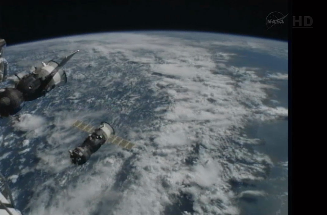 Progress 50 Supply Ship and ISS Above Earth