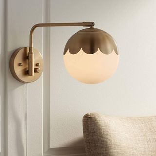 A brass plug-in sconce