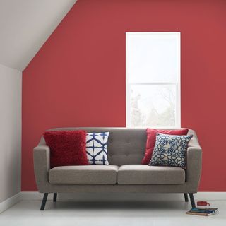 living room with tinsel town red paint wall