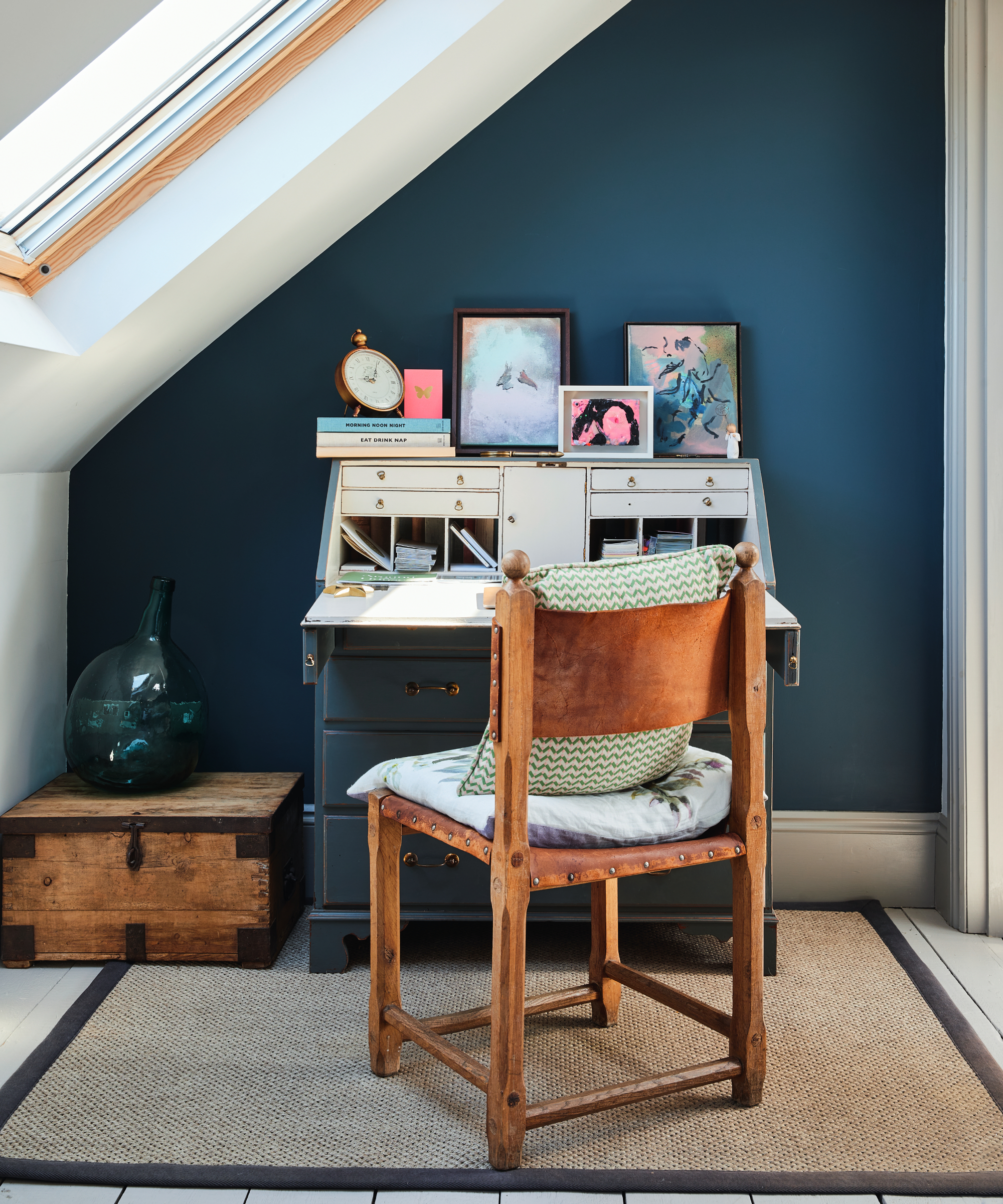 small bureau desk and chair in corner of loft