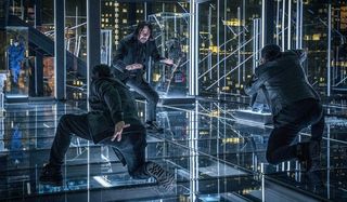 John Wick: Chapter 3 John fights two combatants in The Continental's glass office.