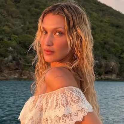 Bella Hadid posed on a yacht in a semi-sheer slip dress worthy of the mermaid summer trend