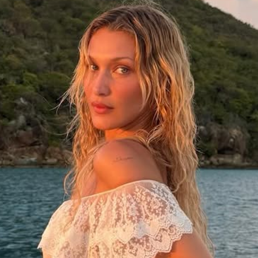 Bella Hadid posed on a yacht in a semi-sheer slip dress worthy of the mermaid summer trend