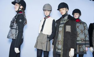 Female models backstage for Moncler Gamme Rouge A/W 2015 modelling the posh equestrian themed collection