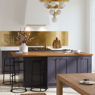 kitchen with blue cabinet and black stool