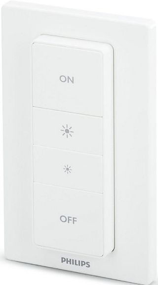 Philips Hue Dimmer Switch slightly angled on a white background