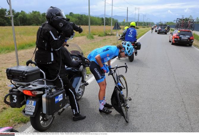 Thomas Dekker (Garmin-Sharp) gets his jacket and rear wheel a little bit too well acquainted with each other