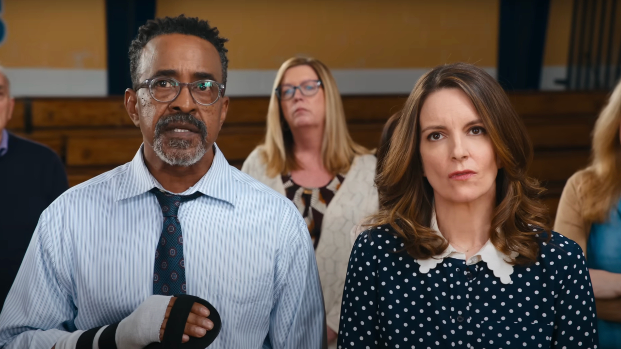 Tim Meadows and Tina Fey standing together in the gym in Mean Girls.