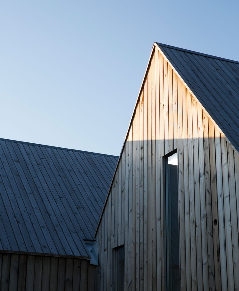 Exterior view of micro cluster cabin on a sunny day