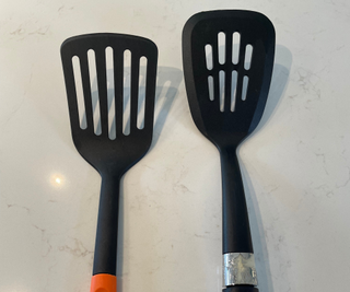 Two black plastic spatulas on my countertop