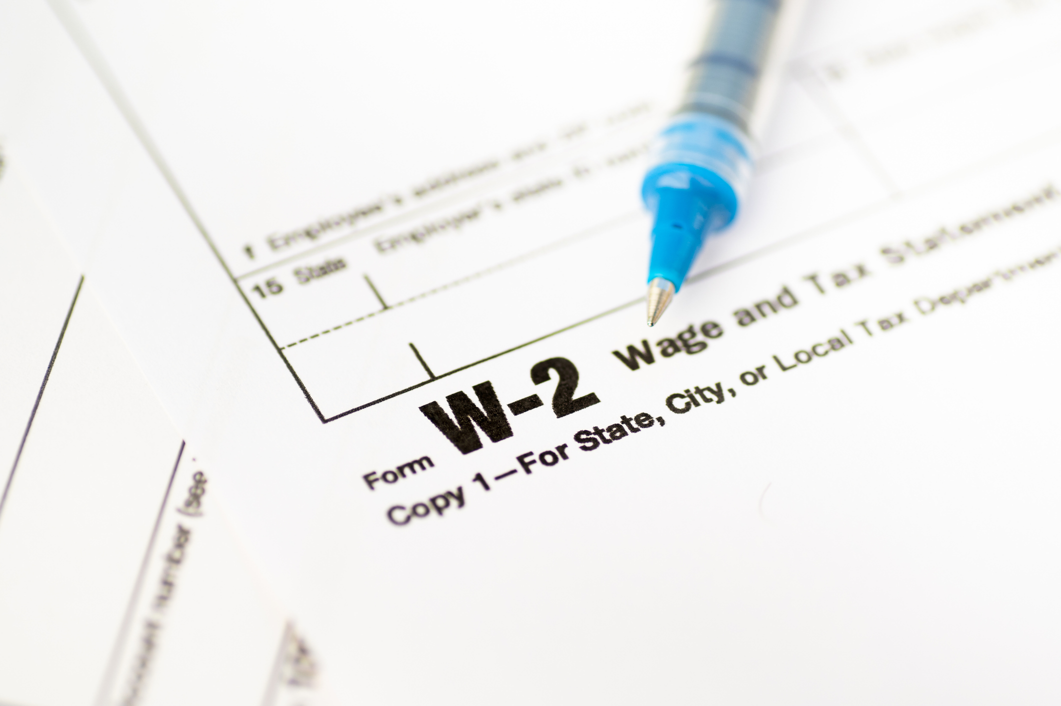 closeup of W-2 Form with a pen