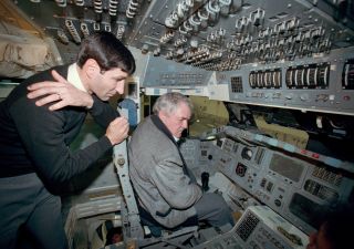 Star Trek Actor Looks at Control Panel at Johnson Space Center