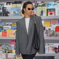 Rochelle Humes styles the Prada satin mules in black with a grey blazer and black bag.