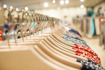 picture of shirts on hangers on a store rack