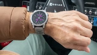 Man in plane cockpit wearing Garmin D2 Mach 1 watch