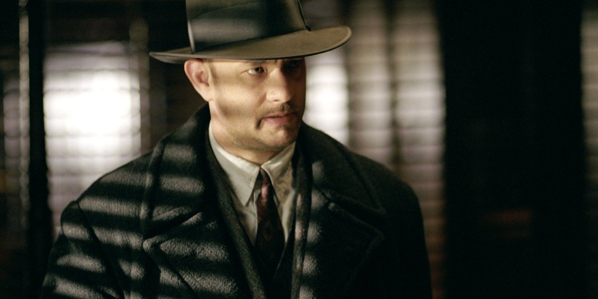 Road To Perdition Tom Hanks looking grim in a suit and overcoat