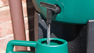 water butt pouring out of the tap