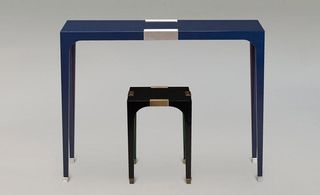 blue console & side table has lacquered feet and details in bronze and matt nickel