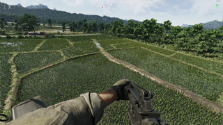 A screenshot from Gray Zone Warfare, showing the player flying over the top of waterlogged fields in a helicopter