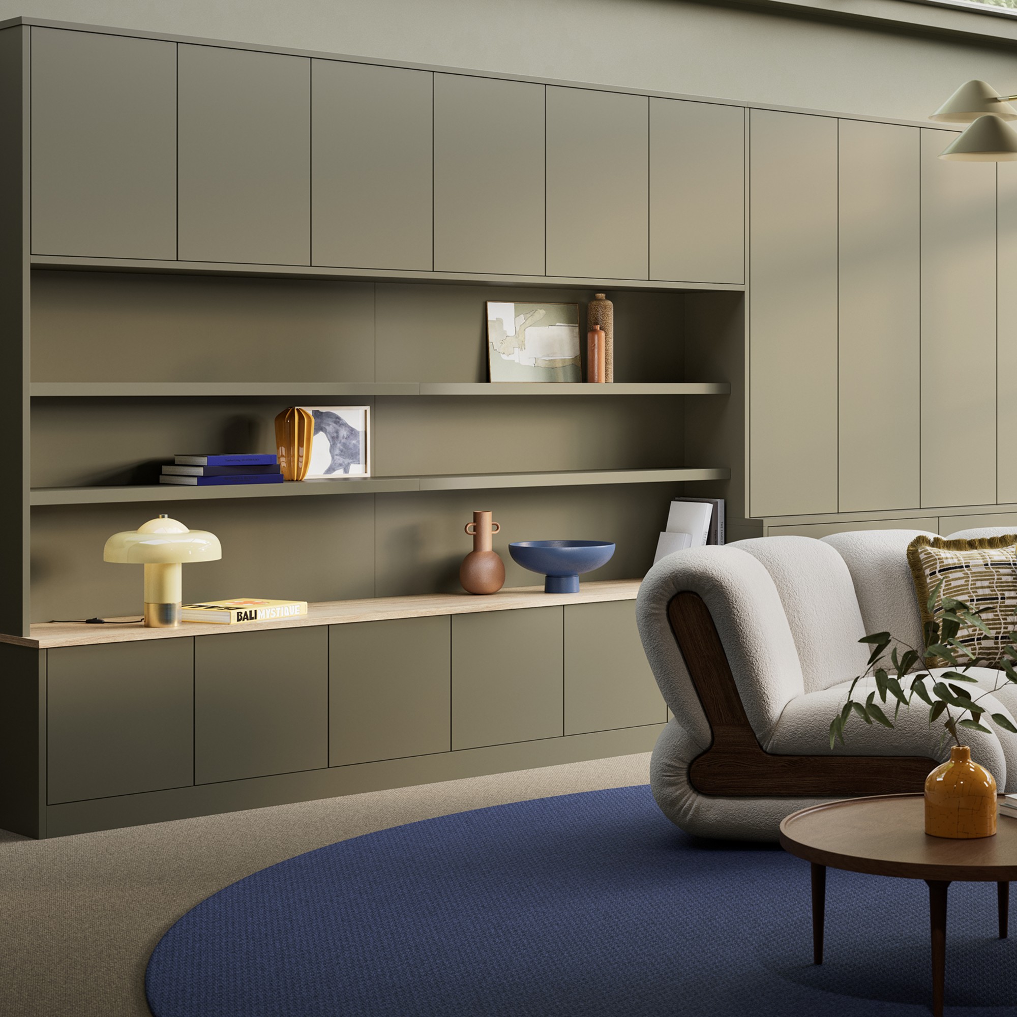 Tavira storage system in Olive Green from Hammonds with a mix of open shelving and closed storage cabinets in a modern living room