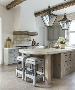 country kitchen with wooden island and antique tops and stools