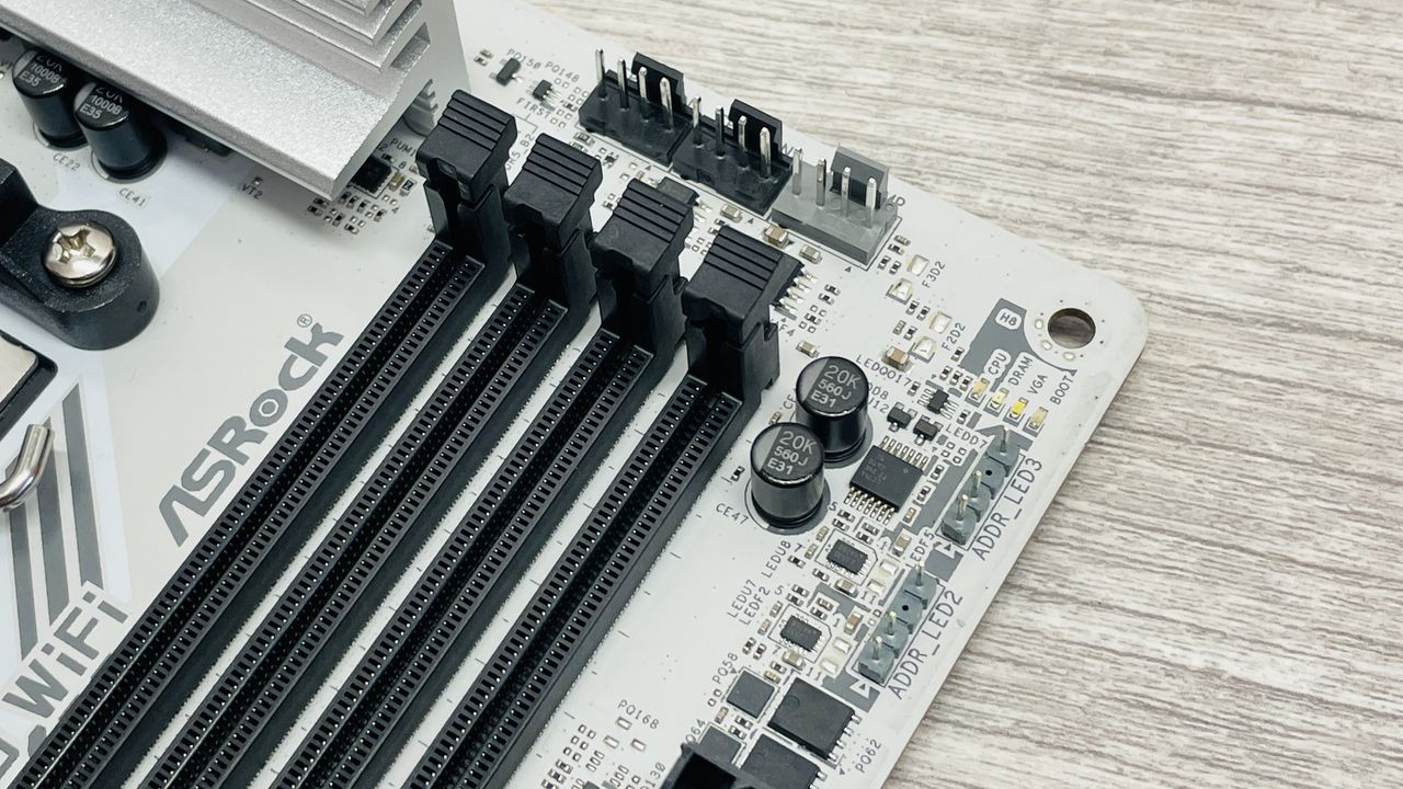 ASRock B850 Steel Legend Wi-Fi motherboard on a desk.
