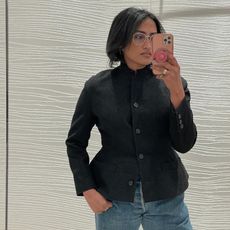 chiara takes mirror selfie and wears black blazer with a cinched waist