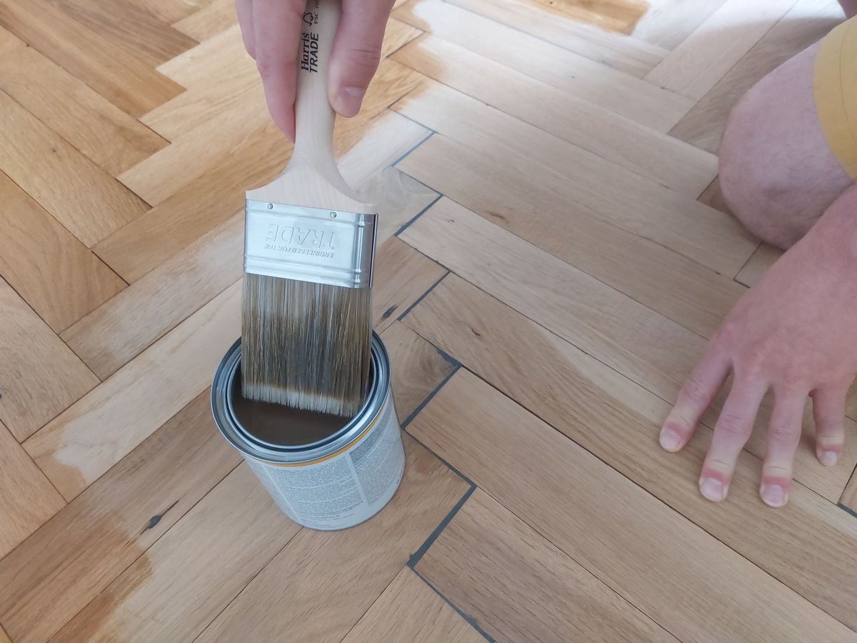Painting varnish onto the finished wooden blocks