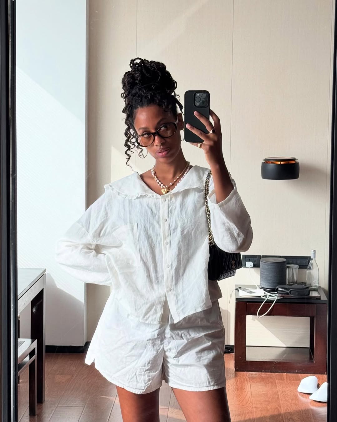 Claire Most wears goddess braids in a messy high bun