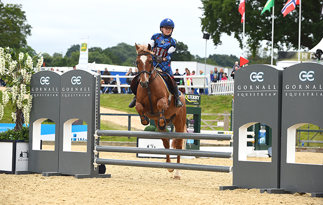 Will Edwards and Ted Holt during the invitational Mini Major Relay during the Equerry Bolesworth International Horse Show at Bolesworth Castle near Chester in Cheshire in the UK on 17th June 2018