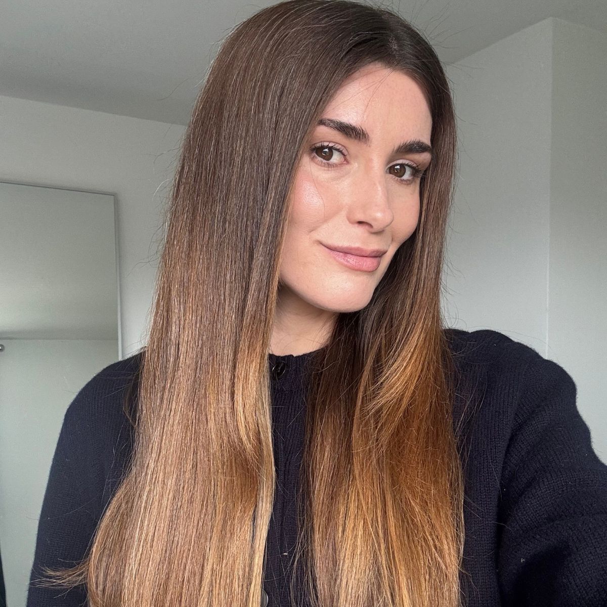 A selfie of Eleanor with straight hair