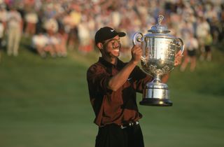 Tiger Woods poses with the 2000 PGA Championship trophy at Valhalla