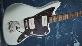 Squier CV Jazzmaster on blue background