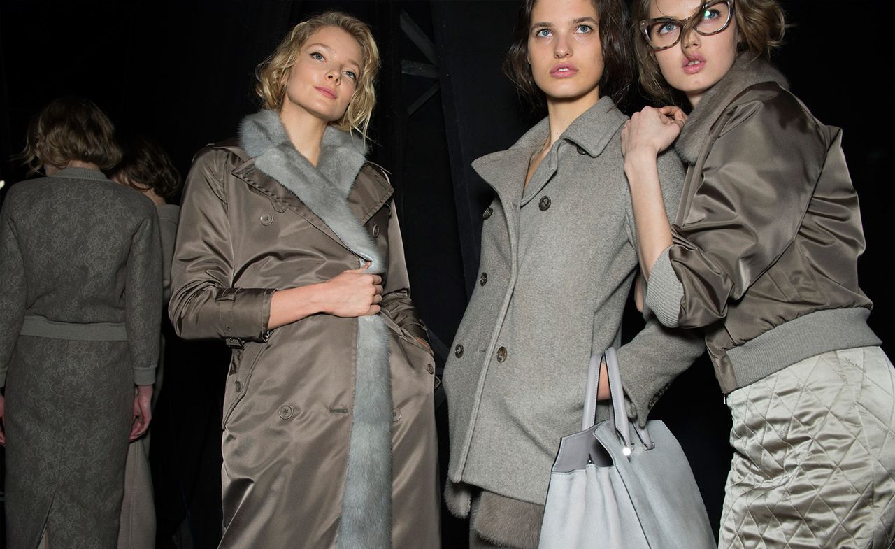 three female models in grey coats